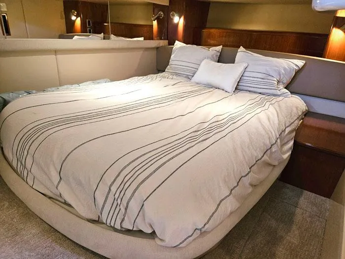 Slide: The Image of Luxurious bedroom interior of 2007 Meridian 411 Sedan yacht with cozy bedding. - 17