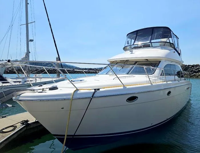 Slide: The Image of 2007 Meridian 411 Sedan yacht docked at marina under clear blue sky. - 2