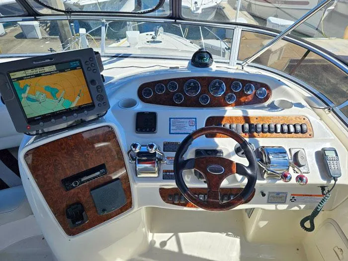 Slide: The Image of 2007 Meridian 411 Sedan helm with navigation system and wood-accented controls. - 22