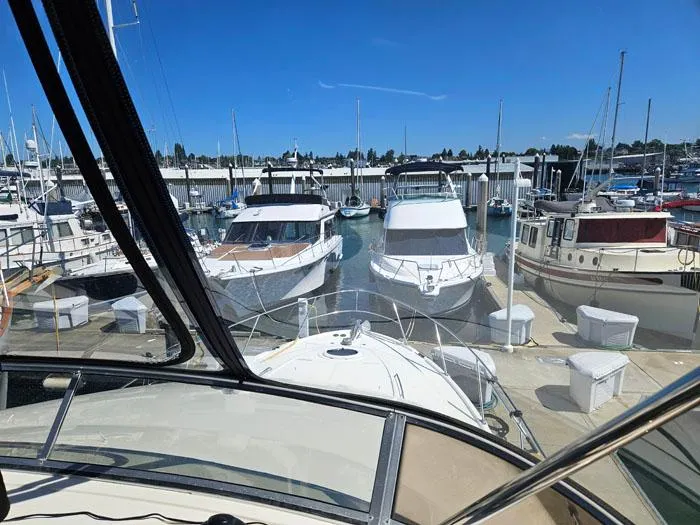 Slide: The Image of View from a 2007 Meridian 411 Sedan yacht docked at a marina under clear blue skies. - 23