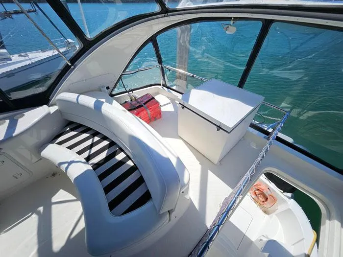 Slide: The Image of 2007 Meridian 411 Sedan interior with curved seating and ocean view. - 24