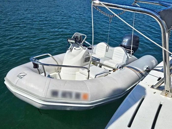 Slide: The Image of Inflatable boat docked beside a 2007 Meridian 411 Sedan yacht. - 27