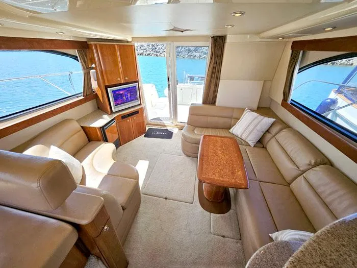 Slide: The Image of Luxurious interior of 2007 Meridian 411 Sedan yacht with leather seating and ocean view. - 6