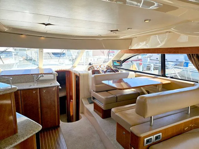 Slide: The Image of Luxurious interior of a 2007 Meridian 411 Sedan yacht with elegant seating and dining area. - 7