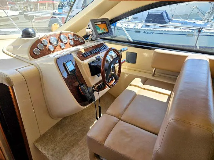 Slide: The Image of 2007 Meridian 411 Sedan helm with leather seating and navigation equipment. - 8