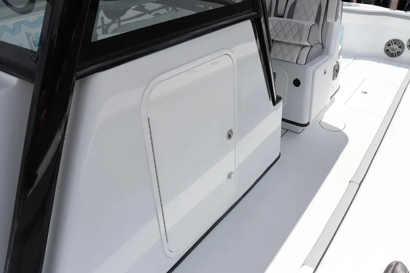 Slide: The Image of 2024 Yellowfin 39 Offshore boat deck with storage compartment and seating. - 10