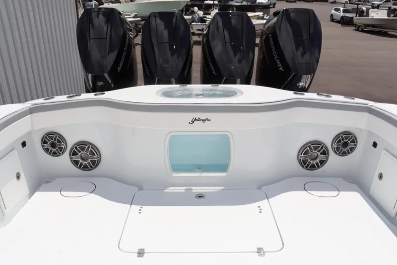 Slide: The Image of 2024 Yellowfin 39 Offshore boat with four powerful outboard engines and modern audio system. - 13