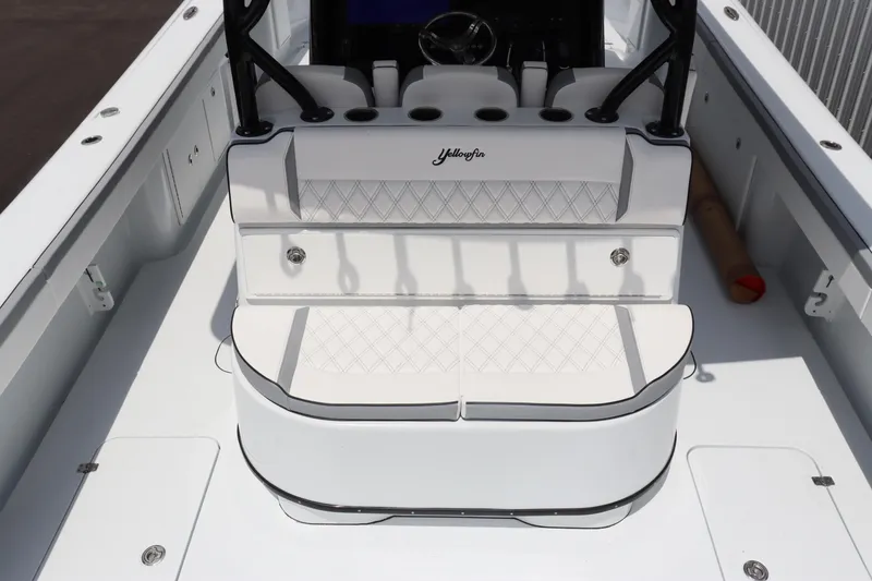 Slide: The Image of 2024 Yellowfin 39 Offshore boat interior with cushioned seating and storage compartments. - 17