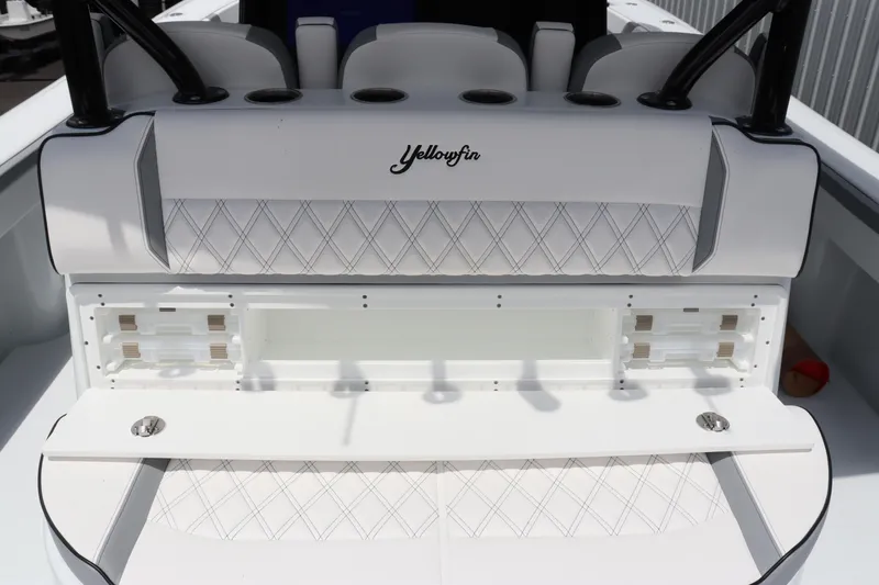 Slide: The Image of 2024 Yellowfin 39 Offshore boat interior with seating and storage compartments. - 21