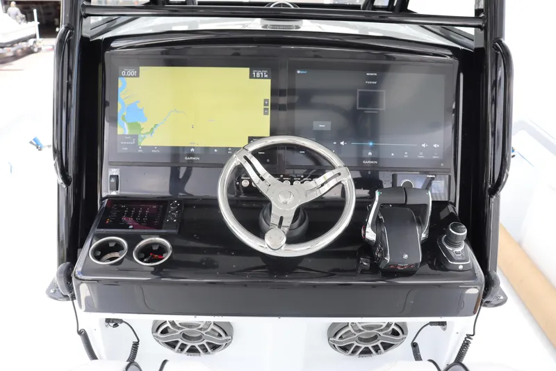 Slide: The Image of 2024 Yellowfin 39 Offshore boat helm with dual displays and modern controls. - 22