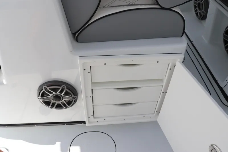 Slide: The Image of 2024 Yellowfin 39 Offshore boat interior storage drawers and speaker. - 25