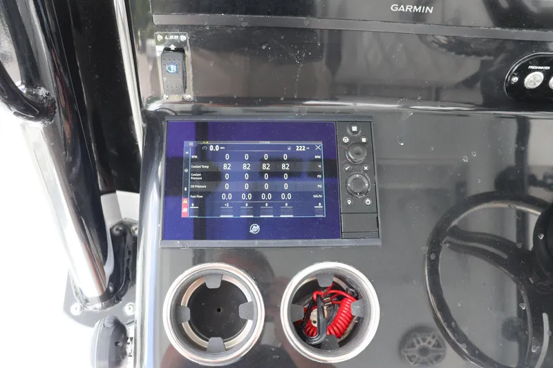 Slide: The Image of 2024 Yellowfin 39 Offshore dashboard with Garmin display and dual cup holders. - 26