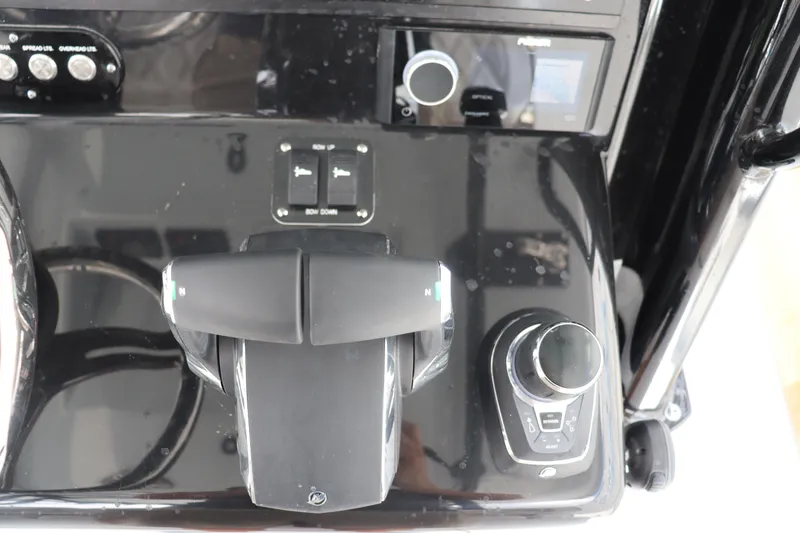 Slide: The Image of Control panel of 2024 Yellowfin 39 Offshore boat with throttle and joystick. - 29