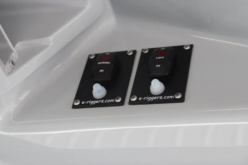 Slide: The Image of Control switches on the 2024 Yellowfin 39 Offshore boat dashboard. - 30