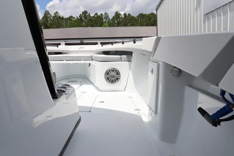 Slide: The Image of 2024 Yellowfin 39 Offshore boat interior with white deck and storage compartments. - 31