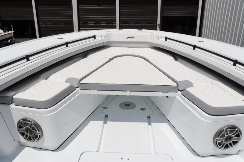 Slide: The Image of 2024 Yellowfin 39 Offshore boat with cushioned seating and built-in speakers. - 34