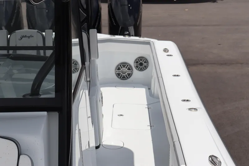 Slide: The Image of 2024 Yellowfin 39 Offshore boat deck with speakers and storage compartments. - 9