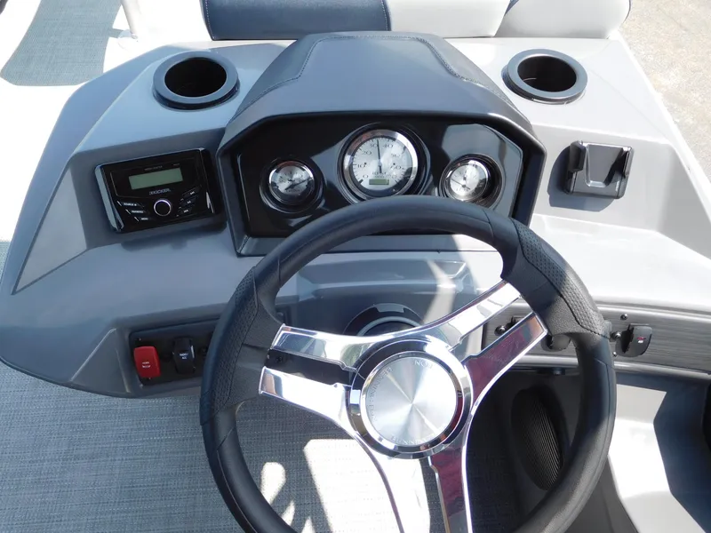 Slide: The Image of 2024 Bennington 22 SSB boat dashboard with steering wheel and instrument panel. - 3