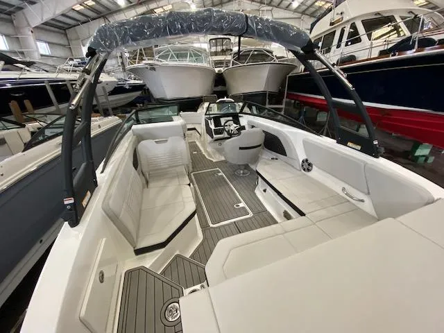 Slide: The Image of 2024 Sea Ray SPX 230 Outboard boat interior with spacious seating and modern design. - 8