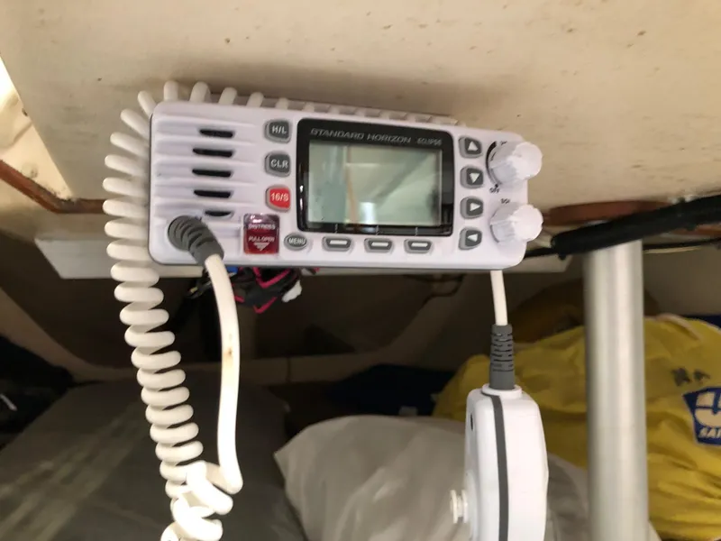 Slide: The Image of VHF marine radio inside a 1991 Tripp 36 sailboat cabin. - 22
