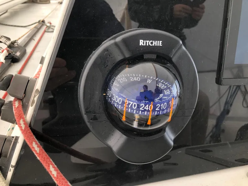 Slide: The Image of Ritchie compass on Tripp 36 sailboat, 1991 model, showing navigation details. - 26