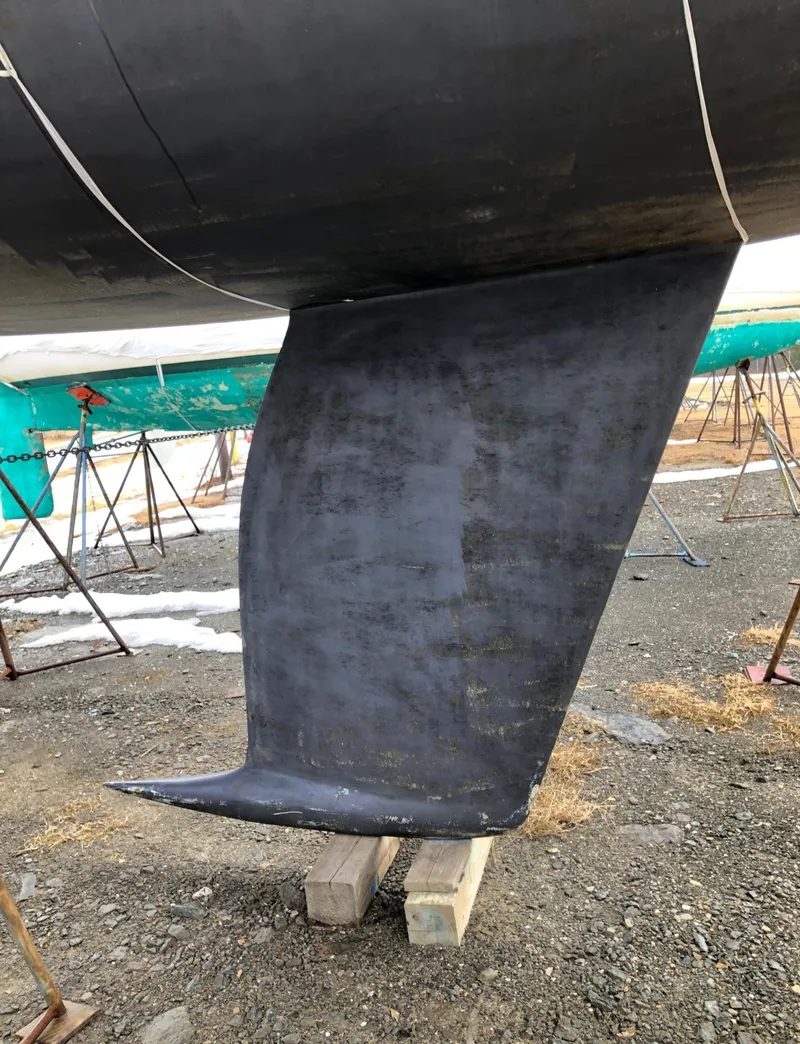 Slide: The Image of Keel of a 1991 Tripp 36 sailboat on blocks in a boatyard. - 34