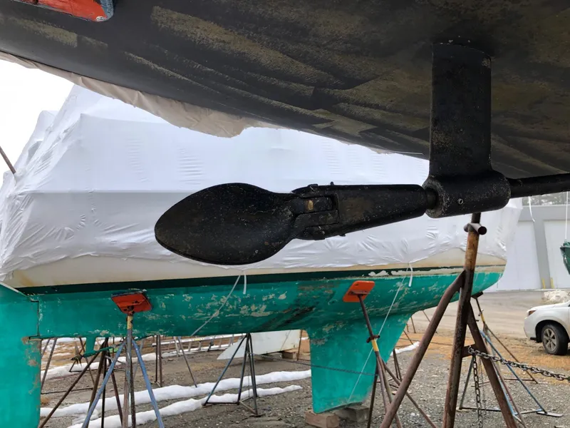 Slide: The Image of Sailboat rudder of a 1991 Tripp 36, dry docked for maintenance. - 37