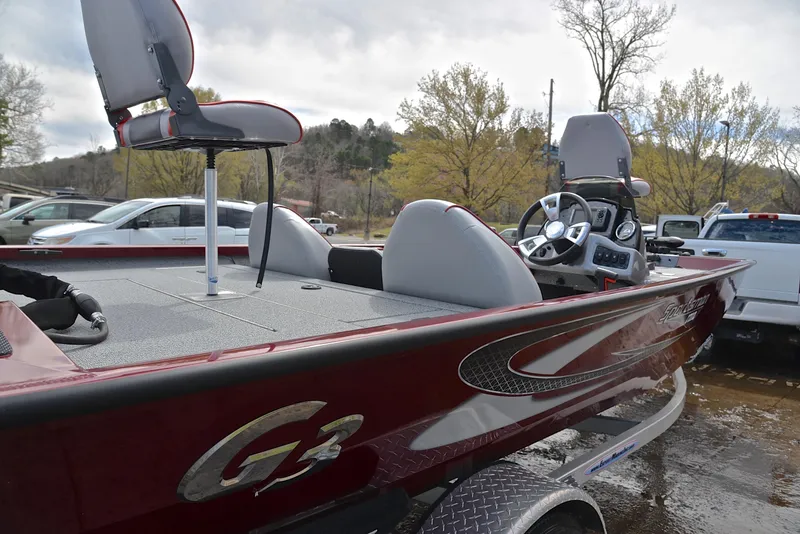 Slide: The Image of 2019 G3 Sportsman 1710 fishing boat with red exterior and seating. - 19
