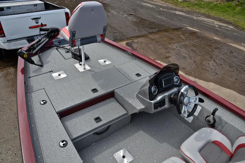 Slide: The Image of 2019 G3 Sportsman 1710 fishing boat interior with steering console and storage compartments. - 23