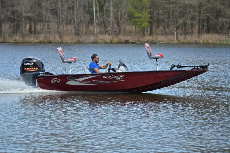 Slide: The Image of 2019 G3 Sportsman 1710 boat cruising on a lake with a Yamaha outboard motor. - 3