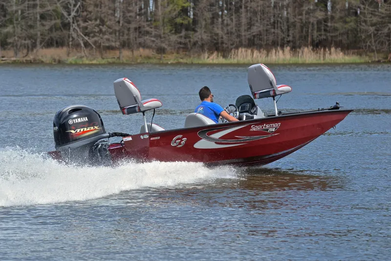 Slide: The Image of 2019 G3 Sportsman 1710 boat speeding on a lake with Yamaha outboard motor. - 5