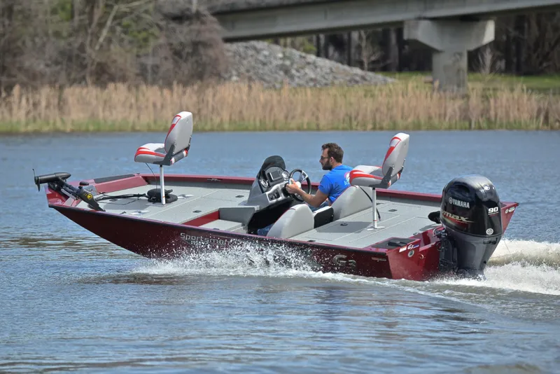 Slide: The Image of 2019 G3 Sportsman 1710 boat cruising on a lake with a Yamaha outboard motor. - 6