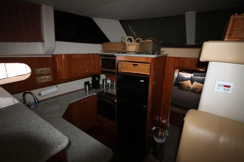 Slide: The Image of 2001 Carver 466 Motor Yacht interior kitchen and living area - 13
