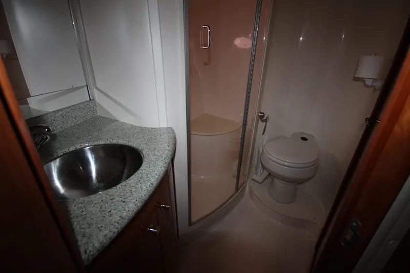 Slide: The Image of Bathroom in 2001 Carver 466 Motor Yacht with sink, toilet, and enclosed shower. - 22