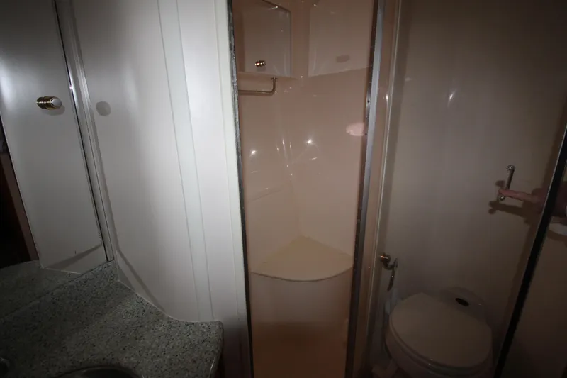 Slide: The Image of 2001 Carver 466 Motor Yacht bathroom with shower and toilet. - 23