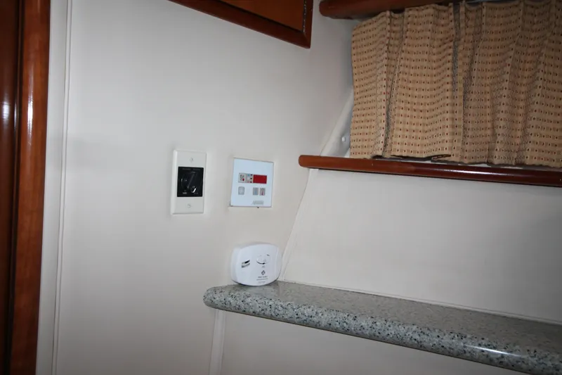 Slide: The Image of Interior of 2001 Carver 466 Motor Yacht with control panel and countertop. - 25