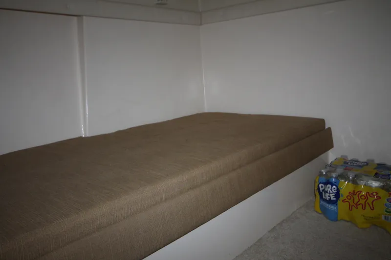 Slide: The Image of Interior cabin bed of 2001 Carver 466 Motor Yacht with storage space. - 29