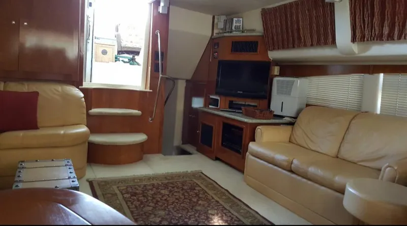 Slide: The Image of Interior of 2001 Carver 466 Motor Yacht with leather seating and entertainment center. - 4