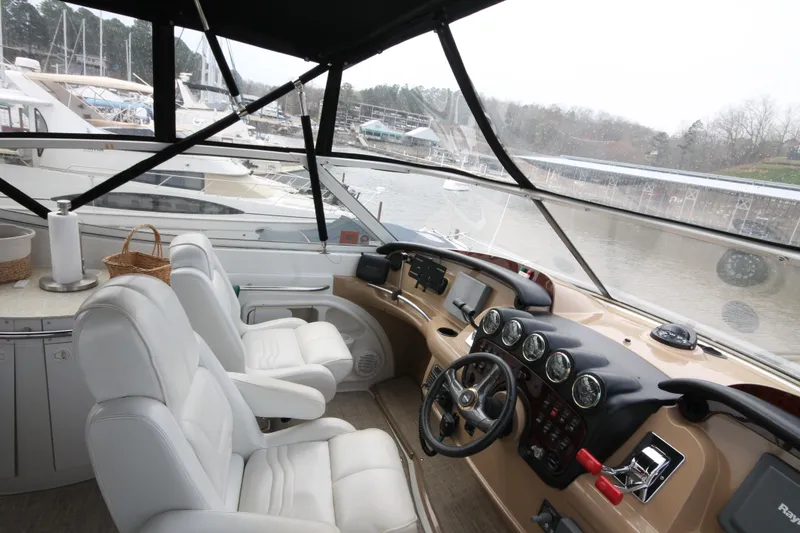 Slide: The Image of Interior helm of 2001 Carver 466 Motor Yacht with white leather seats and navigation instruments. - 44