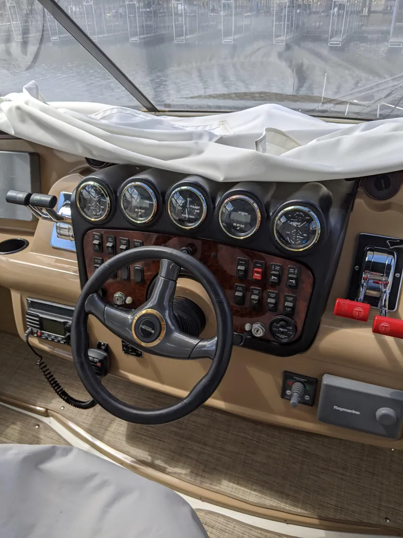 Slide: The Image of Helm of a 2001 Carver 466 Motor Yacht with gauges and controls. - 45