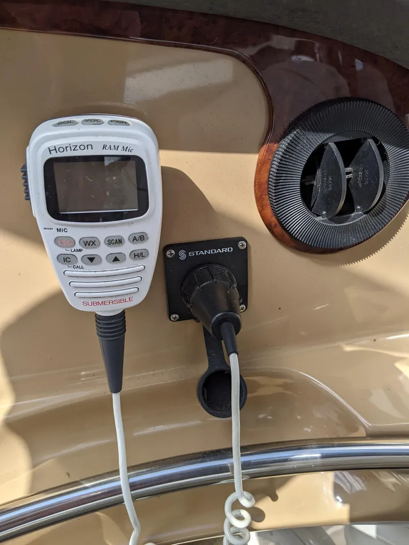 Slide: The Image of VHF radio and speaker on 2001 Carver 466 Motor Yacht dashboard. - 49