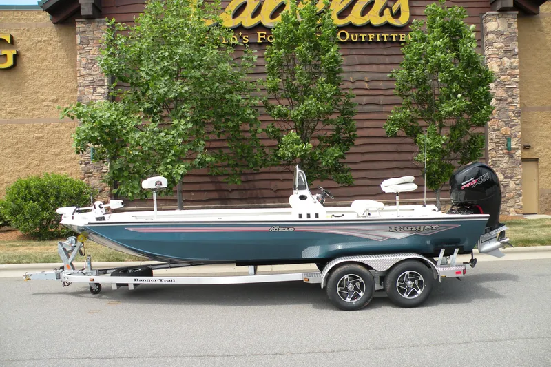 The Image of 2024 Ranger RB210 boat on a trailer in front of Cabela's store. - 0