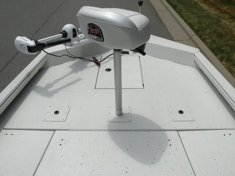 Slide: The Image of 2024 Ranger RB210 boat deck with seat and trolling motor. - 10