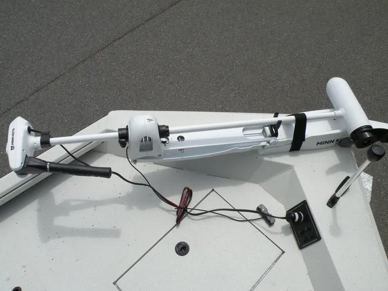 Slide: The Image of 2024 Ranger RB210 boat with Minn Kota trolling motor on deck. - 12