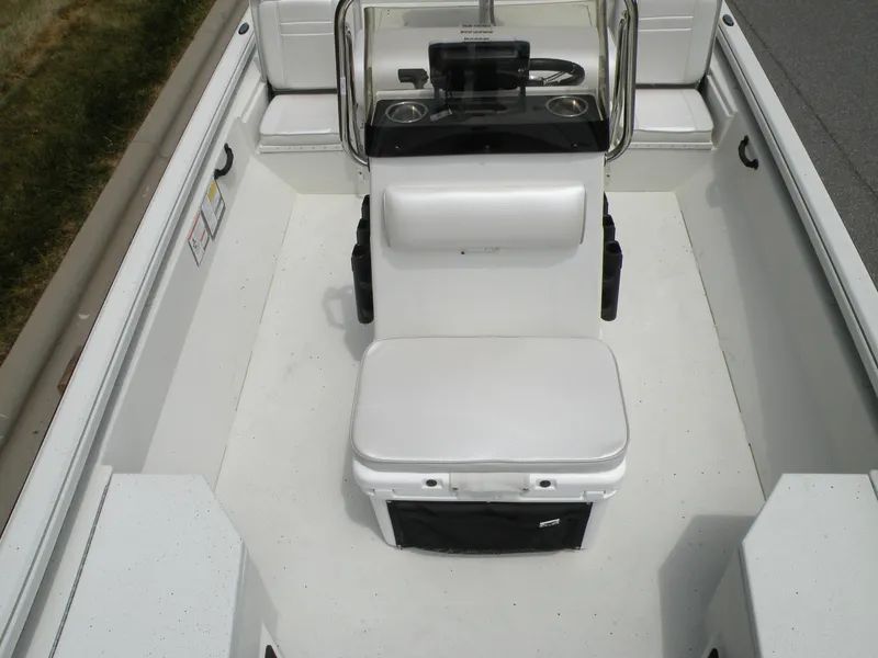 Slide: The Image of 2024 Ranger RB210 boat interior with center console and seating. - 14
