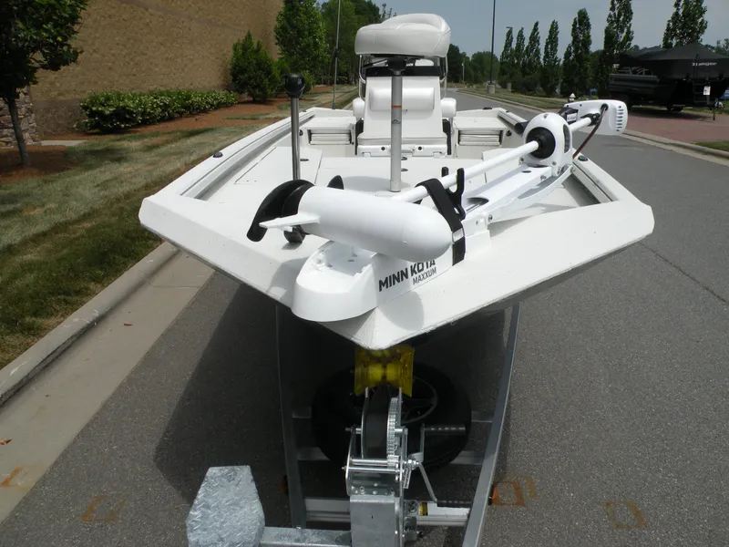 Slide: The Image of 2024 Ranger RB210 boat with Minn Kota trolling motor on trailer. - 2