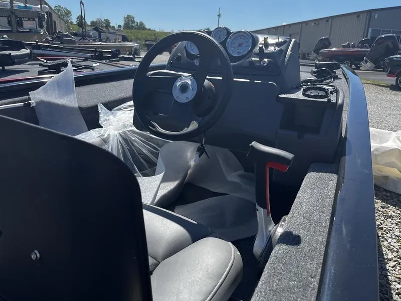Slide: The Image of 2024 Tracker Pro 170 boat interior with steering wheel and controls. - 3