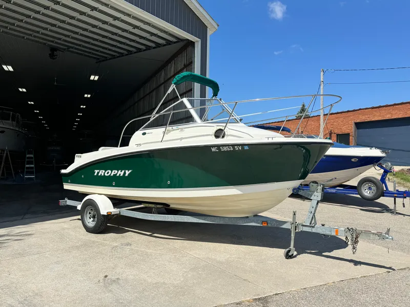 Slide: The Image of 2005 Trophy 1952 Walkaround boat on trailer outside a storage facility. - 1