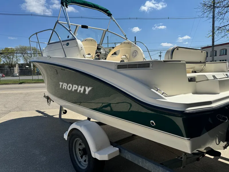 Slide: The Image of 2005 Trophy 1952 Walkaround boat on trailer, side view under clear sky. - 10