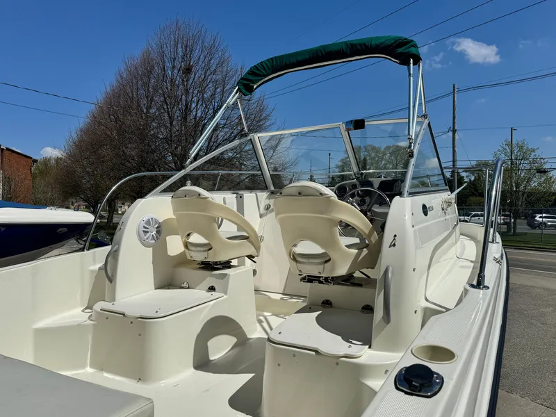 Slide: The Image of 2005 Trophy 1952 Walkaround boat with dual seats and green canopy. - 13